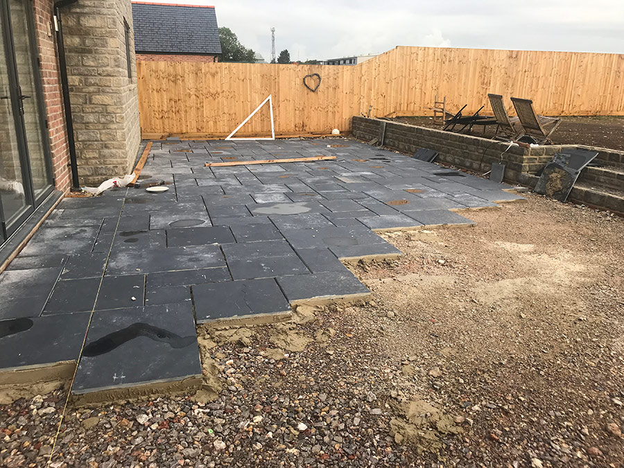 Elegant Stone Patio An elegant stone patio with outdoor furniture, perfect for relaxing and entertaining.